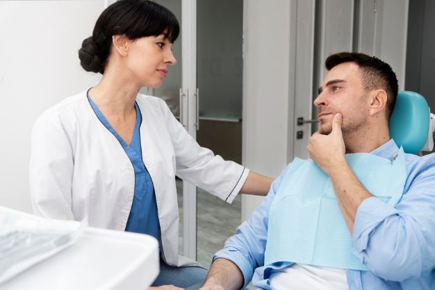 dentist explaining dental care coverage